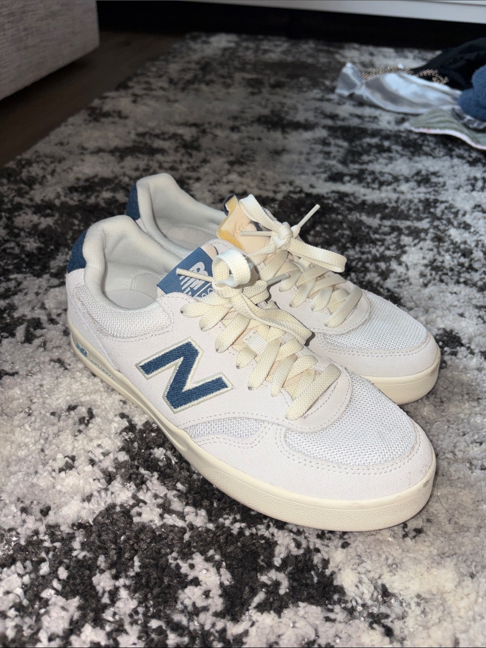 New Balance Men's White Sneakers with Blue Accent N Logo